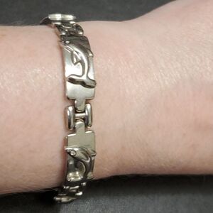 Silver tone dolphin link bracelet 7"